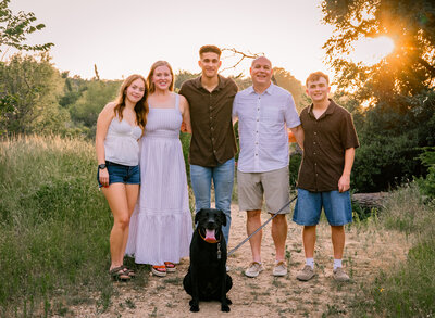 Family at sunset with dog
