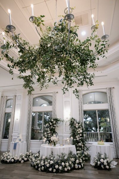 West Palm Beach wedding photographer, Priscila Del Cristo, capturing Gracey and Bobby's wedding flowers in the lobby at The Club at The Strand.
