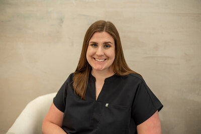 Female medical assistant wearing black scrubs