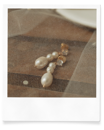 detail shot of brides earrings on wedding day at prince edward island