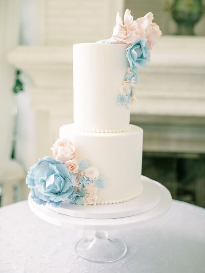 wedding cake with blue flowers