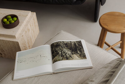 kaboompics_open-book-on-minimalist-sofa-calm-interior-design-inspiration-37337