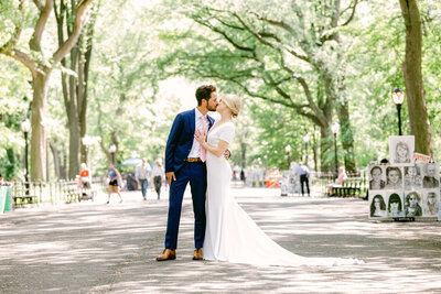 A couple kiss after their wedding ceremony at the Dene Shelter in Central Park