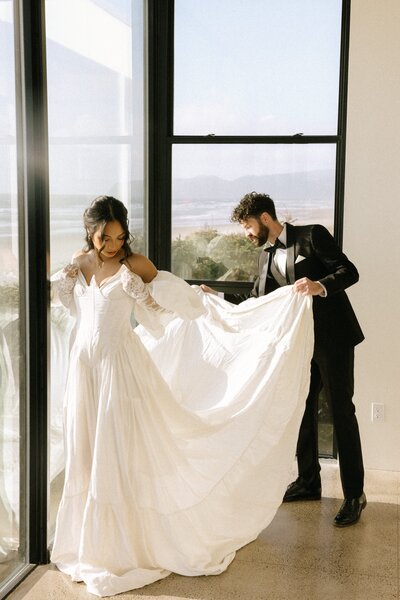bride and groom photos in front of a big window