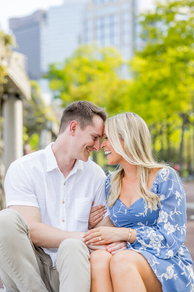 boston engaged couple at the beach hugging in golden hour