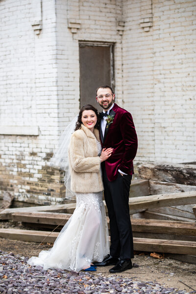 couple posing for wedding photo in winter
