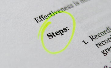 The word steps highlighted in a book to symbolize the importance of having a web design process
