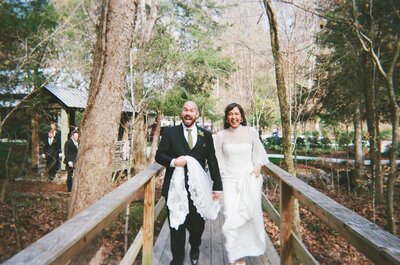 Victoria Barclay, photographer at Through Victoria's Lens, and her husband walking together on their wedding day