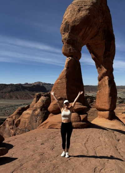 by becca photographer on a hike with red rocks surrounding all sides