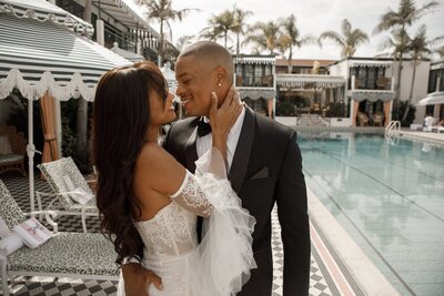 couple embrace for wedding photos in san diego 