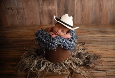 newborn boy with cowboy hat