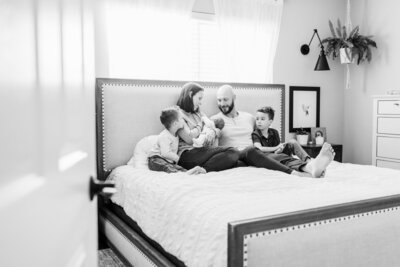 In-home lifestyle Newborn Photo session, sibling love, taken in Lake Forest, California