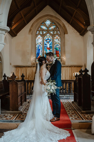 Bride and groom in historical chapel