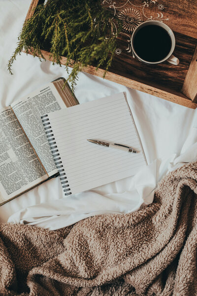 Notebooks, blanket, coffee