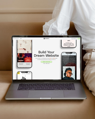 A silver laptop open, displaying the user-friendly interface of the Showit drag-and-drop web design platform with a website in progress, promoting its flexibility and ease of use.