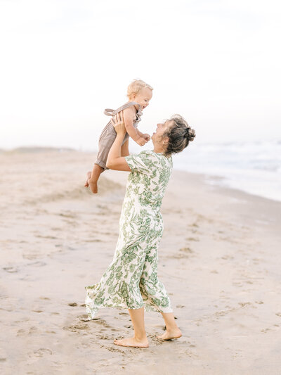 Baby girl wearing a white tutu in a studio space.