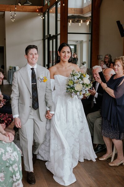 Brides walking into reception