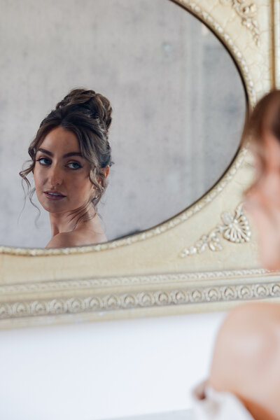 A portrait of a bride in a mirror.