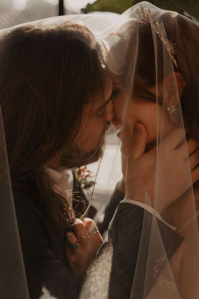 bride and groom embrace at wedding reception