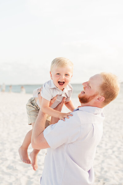 close up of mother holding baby in belly