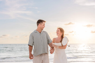 St. Pete couple getting their engagement photos taken on Pass-a-Grille Beach