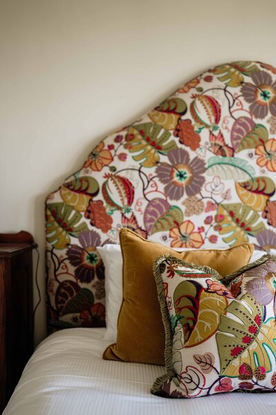A bold print bed headboard. 