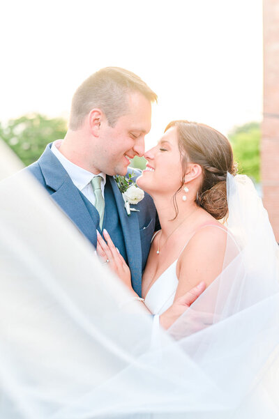 bride and groom touch noses