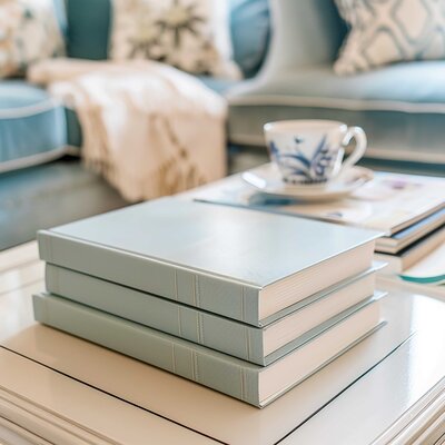 Stack of books and tea cup in cozy blog coaching space — inviting readers to book a free blogging business clarity call for custom strategy