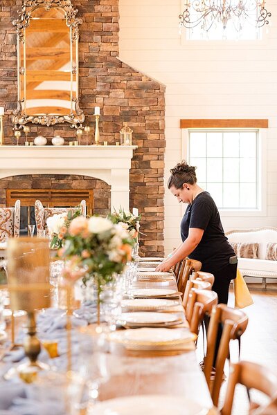 Behind the scenes photo of the catering staff setting up the reception at a wedding at The Seclusion in Lexington, Virginia.