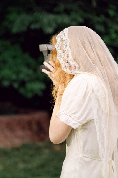 Bride peyton curry captures polaroid at backyard wedding in Richmond, VA.