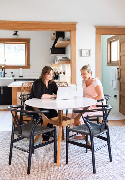 Santa Barbara realtor, Lindsey Drewes, consults with first time home buyer at kitchen table