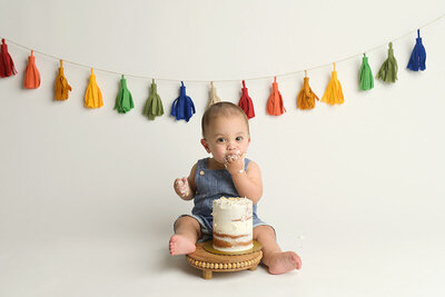 one year old baby eating cake