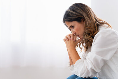 Woman struggling with OCD finding answers in therapy for OCD.