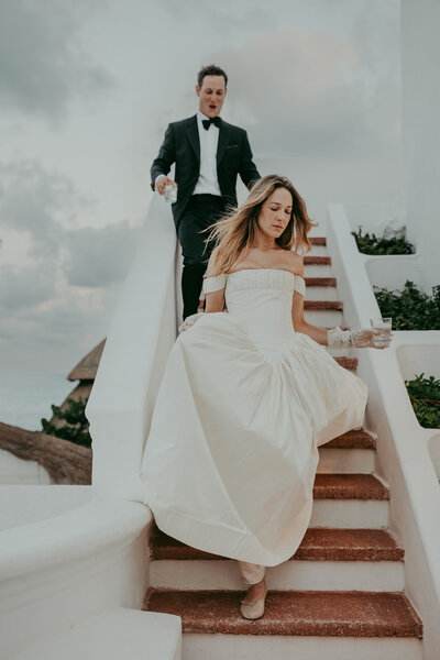 Bride and groom holding hands and looking in each others eyes