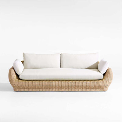 Wicker and upholstered outdoor sofa. 