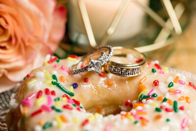 Wedding rings on sprinkle donut