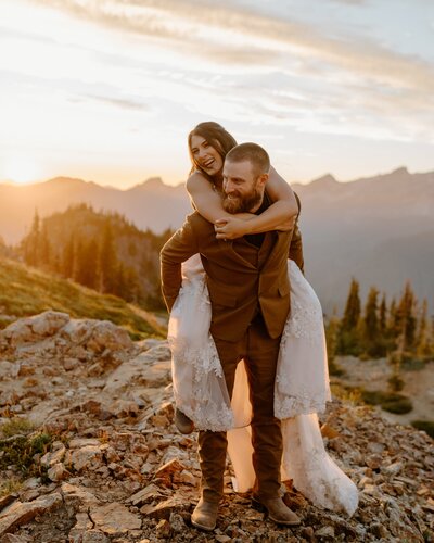 groom giving bride piggyback ride