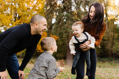 mother holding little girl during bend family photoshoot