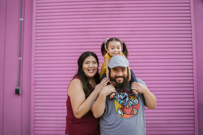 San Antonio Photographers Irene Castillo and David Castillo with their daughter posing for instagram photo