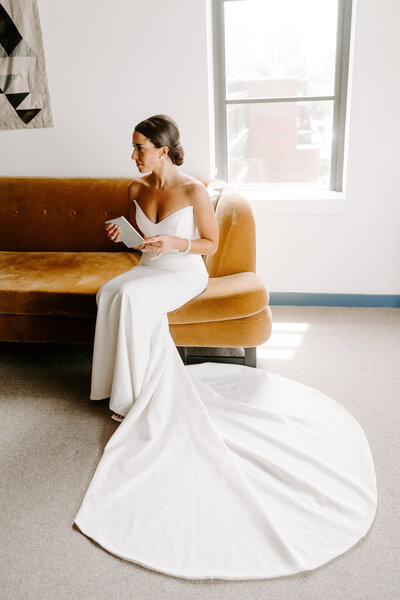 A chic and classic bride reads her vows in a downtown chicago hotel.