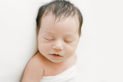 Simple and clean newborn baby portraits.