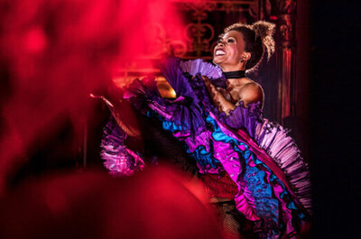 woman on stage performing in the musical moulin rouge