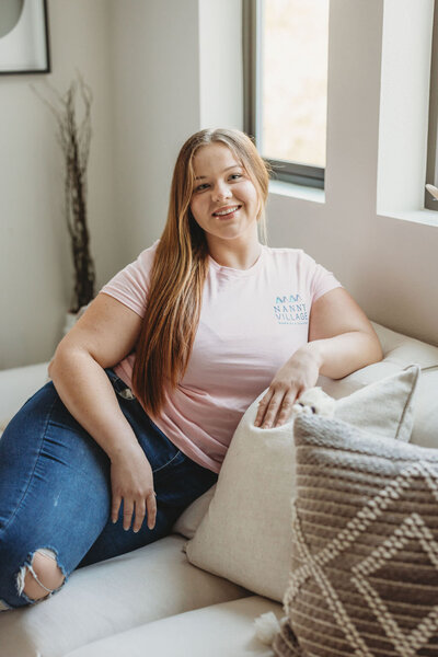 Household Manager sitting on couch