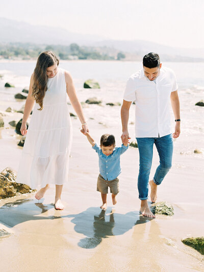 A family walking on the beach in Ventura County by photographer Daniele Rose