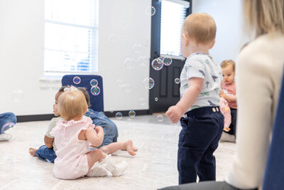 Toddlers playing with bubbles