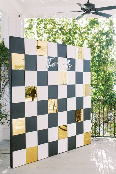 checkered backdrop for San Antonio wedding photo booth