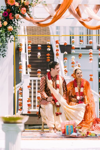 groom and bride sitting during hindu wedding ceremony