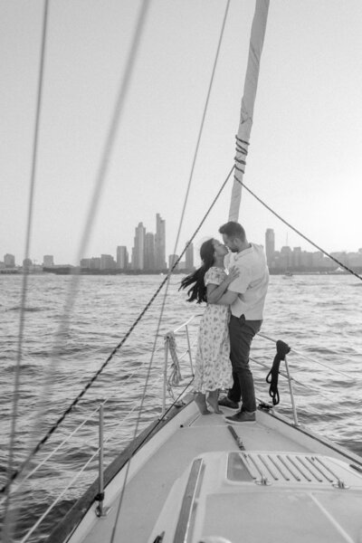 a man and woman on a sailboat