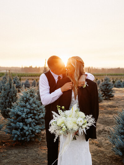 Arizona Bride & Groom smiling at each other during sunset.