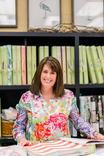Brand photography session with interior designer in bright floral shirt  in  design showroom